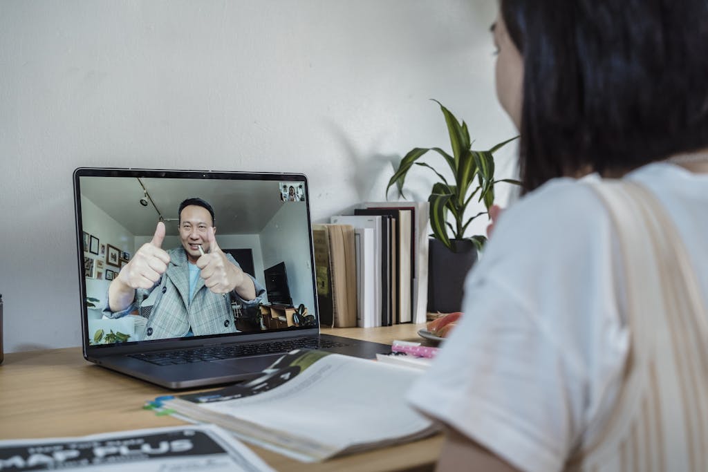 A student engaged in an interactive online class via video conference.